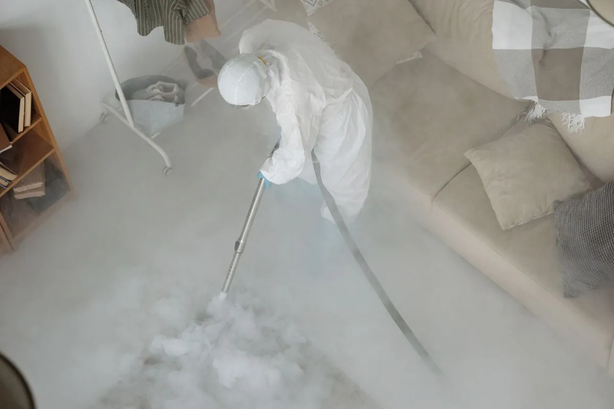 Biohazard cleanup technician in protective equipment, LaSalle Gardens, Detroit, MI